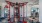 Red fitness equipment in the gym of our Arlington apartments. Walls have decorative circles and mirrors.